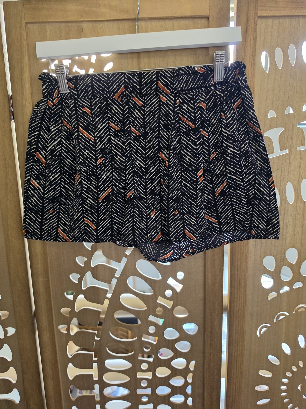 Francesca's Collections Navy Shorts with Orange Fleck Pattern